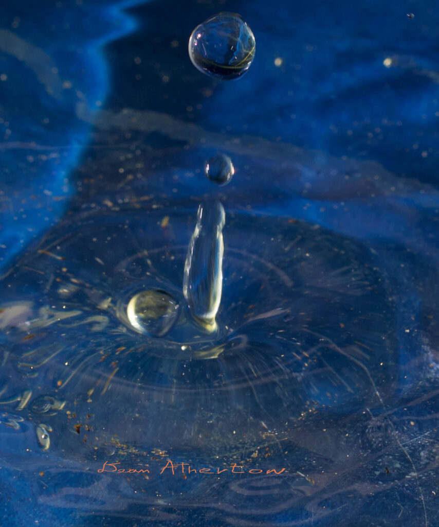 Water drop at slow shutter speed to show motion blur of water drops